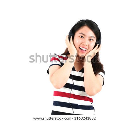 Young asian woman wearing headphones against a white background