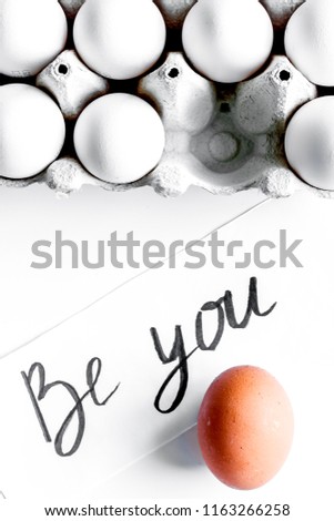 concept of correct choice eggs on white background top view