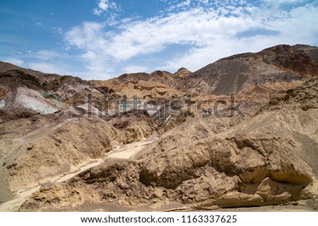 Artist's Palette in Death Valley National Park features colorful rock formations in an alluvial fan in the Black Mountains