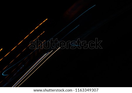 Speed motion abstract background in the dark night light lines with long exposure.