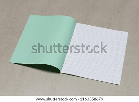 open school notebook in a narrow line with a slash for learning spelling, mock up with copy space on a gray background