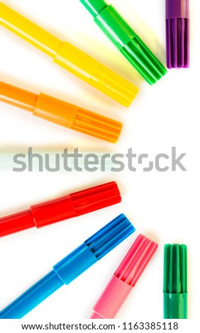 Colorful marker pen in round on isolated background. Vivid highlighter and copy space for your design or montage. View from above.