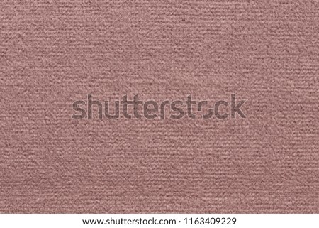 Soft textile background in light pink hue. High resolution photo.