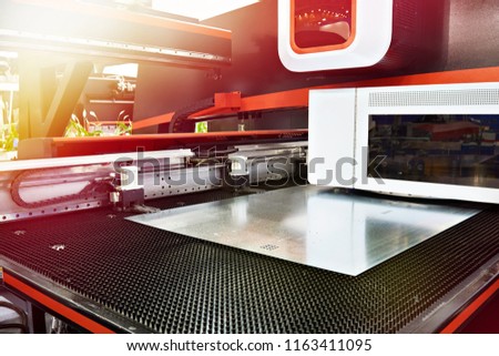 Electro mechanical coordinate and turret punch press with CNC Royalty-Free Stock Photo #1163411095