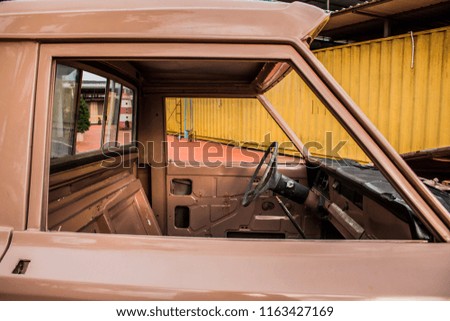 Close up of the inside of an old rusted and abandoned car