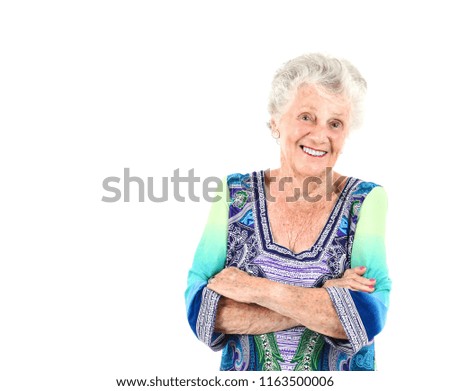 Happy old woman smiling against a white background