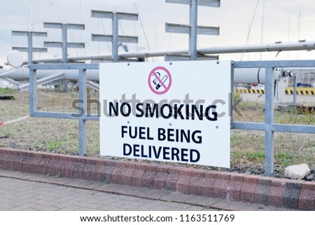 Fuel being delivered no smoking sign at oil and gas refinery delivery