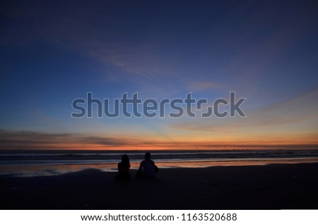 the couple is enjoying the sunset Royalty-Free Stock Photo #1163520688