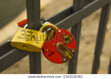 Padlocks on a bridge. Lock as symbol of true and endless love. Relationship and marriage concept.