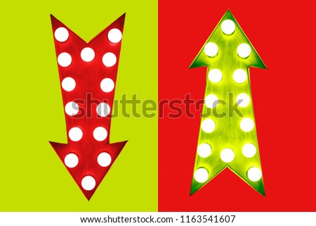 Pros and cons red down and green up vintage retro arrows illuminated with light bulbs. Concept image for advantages and disadvantages, risk and opportunity. Cut out isolated green red background.