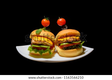 mini cheese burger sandwich with tomato and lettuce