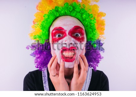 girl in a bright image of a clown. emotional portrait of a student. costumed presentation of children's animator. Female clown
