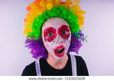 girl in a bright image of a clown. emotional portrait of a student. costumed presentation of children's animator. Female clown
