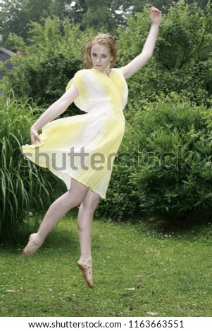 girl in the air in the garden in a beautiful yellow dress  fairy