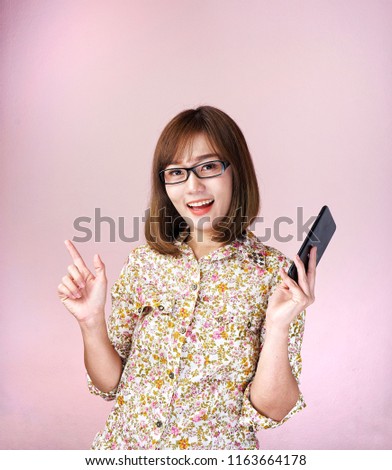 Asian women Brown Shirt The background color is pink poses