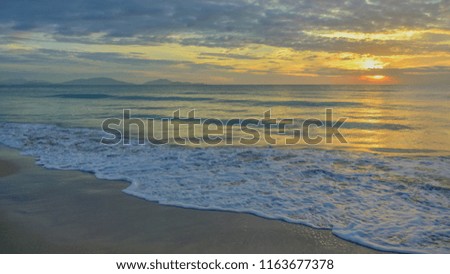 Sea waves and beautiful sunset