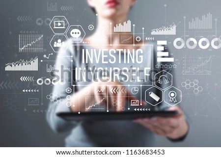 Investing in yourself with business woman using a tablet computer Royalty-Free Stock Photo #1163683453