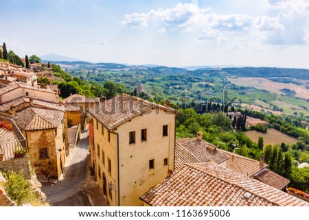 View of Renaissance Houses and Fields of Montepulciano, Italy Royalty-Free Stock Photo #1163695006