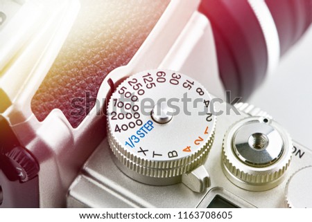 Buttons and control dial on SLR camera closeup