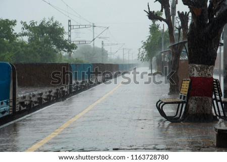 Rain on railway station platform