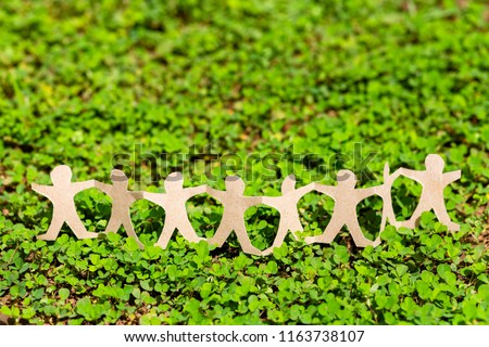 Human chain paper on green creeper plant, CSR (coporate social responsibility) or teamwork concept Royalty-Free Stock Photo #1163738107
