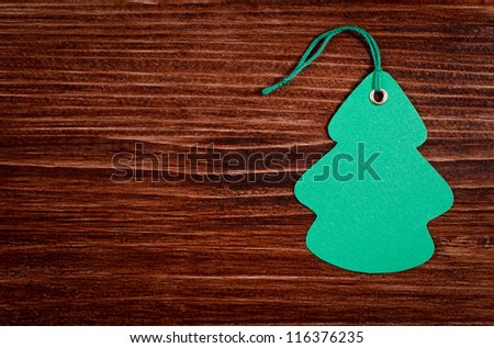 Green label on the wooden background
