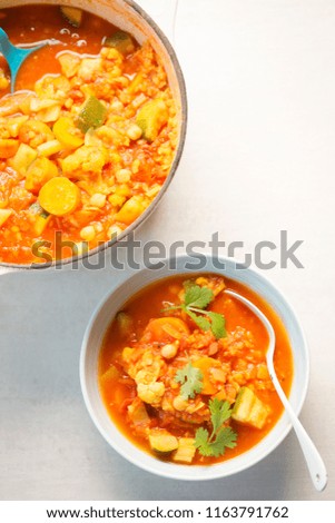 Bowl of vegetable - cauliflower, tomatoes, carrots & fennel soup