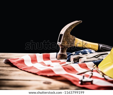 Happy Labor day. Construction tools. Copy space for text on black background.  Laborer repair and property maintenance