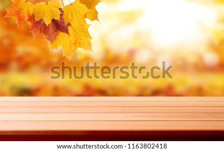 Wood table top on shiny bokeh gold background - can be used for display or montage your products. Mock up perspective.