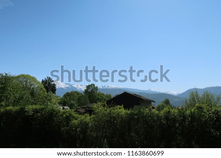 Photography that is showing the Alps mountain from the city of Grenoble, France