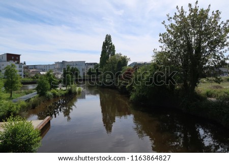 Photography showing the Ille-et-Rance water canal. The photography was taken from the street of the city of Rennes, France.