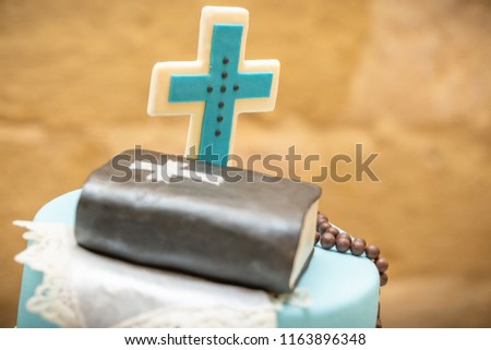 Holy Communion Cake decorated with bible and cross iceing on top