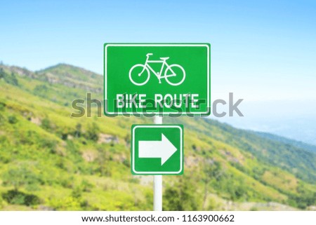 bike route street sign with beautiful mountain and blue sky background