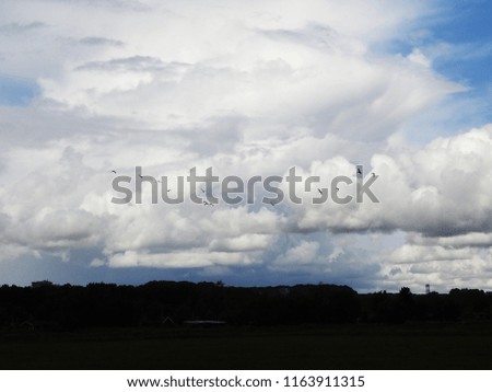 dramatic cloudscape over silhouette horizon