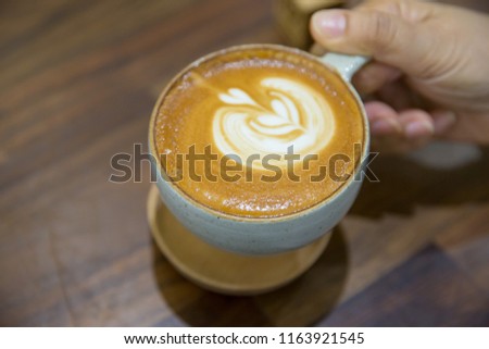 Closeup of female hands with a mug of coffee
