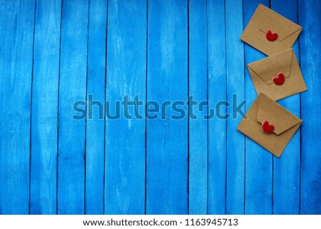 Wooden blue background, cool texture. Pretty letters with hearts. I love you!