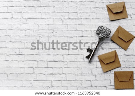 White brick wall. Cool background with beige letters and silver key. Cool texture for magazine and instagram. Happy Valentines Day! I love you.