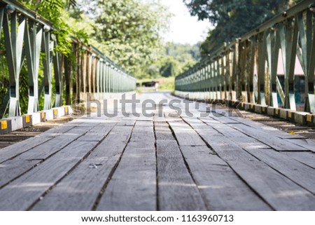 Old wooden bridge with bokeh blured forward  destination foreground