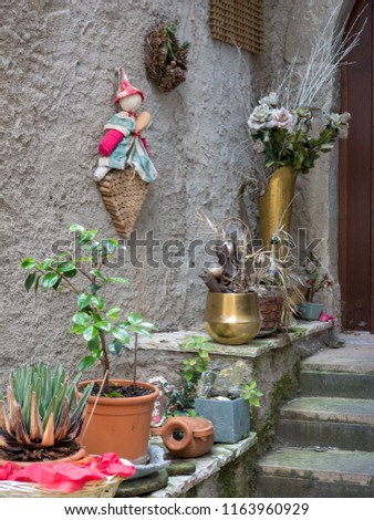 Decoration items on a stairway in front of a house