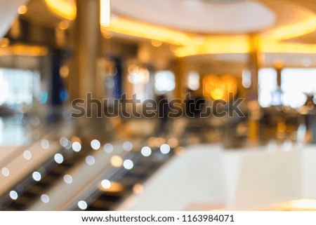 blurred photo of department store or shopping center. The inside looks stylish and beautiful.
