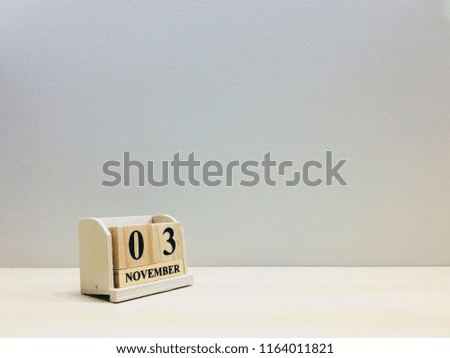 November 3rd,Image of number 3 wooden on grey and light brown color background with space for your text and design.Concept be used for birthday,appointment and deadline.Blur picture and vintage style.