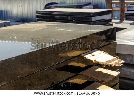 Marble and granite slabs for making tombstones in the warehouse