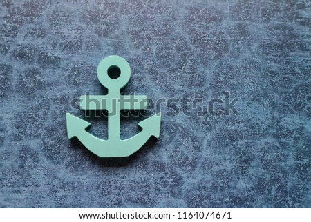 Anchor symbol on blue pattern with space background