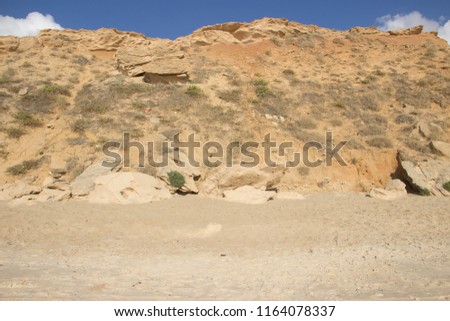 Beautiful sandy cliffs against the backdrop of the picturesque sky