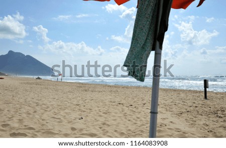 Under the umbrella on the beautiful Sabaudia beach. Sabaudia, Lazio, Italy