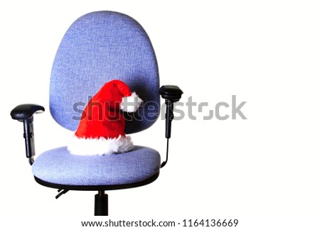 christmas hat on a chair in the office no people stock photo
