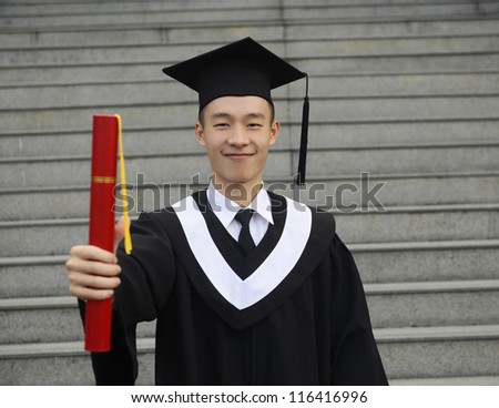 isolated studio picture from a young graduation man