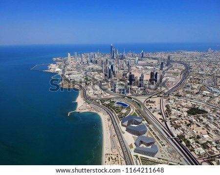 Flying Over Kuwait City On A Summer Day Royalty-Free Stock Photo #1164211648