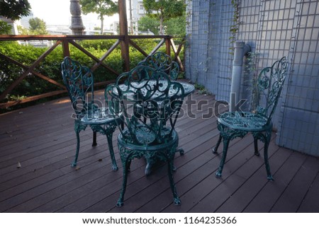 Steel chair & table with four side sitting arrangement in a hotel.