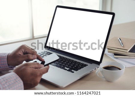 man of business man hand working on laptop computer blank white screen laptop  on vintage wooden